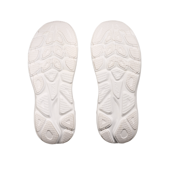 A pair of white HOKA Mens Clifton 10 soles with textured treads, shown side by side on a plain background—ideal for cushioned comfort and plantar fasciitis relief.