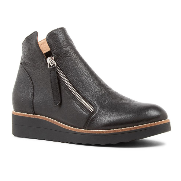 The Django & Juliette Womens Ohmy Black/Black bootie features black leather, a side zipper, beige lining, a black wedge sole with brown trim, a smooth finish, rounded toe, and comfort design for plantar fasciitis relief.