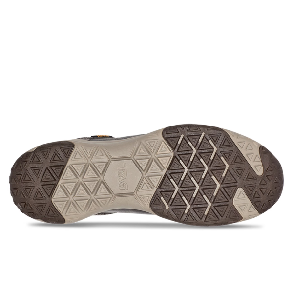 The image displays the sole of the Teva Mens Canyonview RP Grey/Burro, a waterproof hiking shoe featuring a geometric hexagonal tread in brown and beige tones, with Teva embossed at the center.