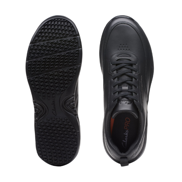Top and bottom views of the CLARKS Mens Pro Lace Black Leather sneaker, featuring perforated detailing at the toe, a textured slip-resistant sole, and a “ClarksPRO” comfort tech insole for enhanced support.