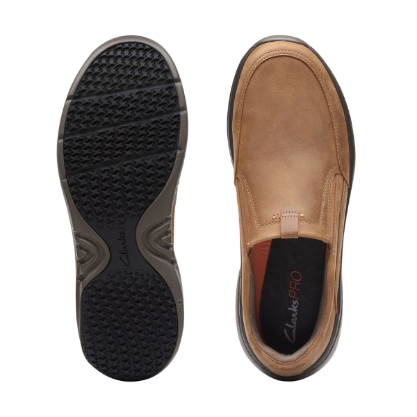 Top and sole view of the Clarks Mens Pro Step Beeswax Leather loafer, a slip-on by CLARKS with black rubber, slip-resistant sole, subtle stitching, and removable insole labeled “Clarks PRO.”.