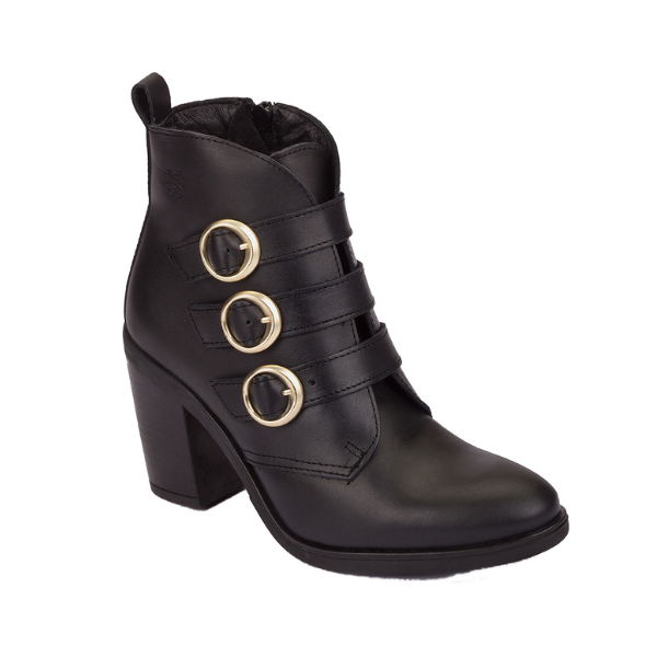 The NASSIMA Nassima Womens Tours 005 Black Leather bootie features three horizontal straps with large round gold buckles, a chunky high heel, and a side zipper—combining style and functionality for any occasion.