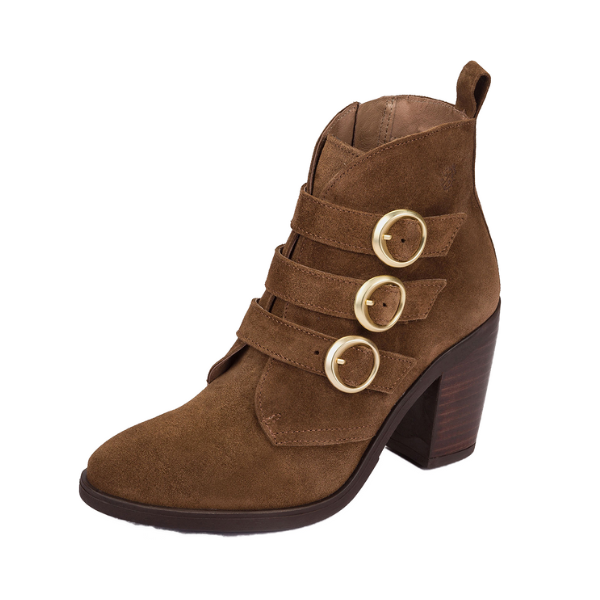 The NASSIMA Nassima Womens Tours 005 Brown Suede bootie features three decorative straps with round gold buckles, a pointed toe, chunky high heel, back pull loop for easy wear, and offers great arch support for comfort.