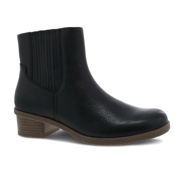 The Dansko Womens Daisie Waterproof Black boot by DANSKO features textured leather, elastic side panels, a rounded toe, and a low brown block heel for stylish comfort and pain relief.