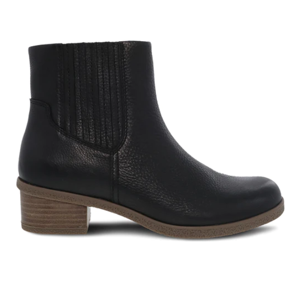 The Dansko Womens Daisie Waterproof Black boot by DANSKO features black leather, a waterproof design, low brown block heel, textured side panels, rounded toe, and Natural Arch technology for foot pain relief. Side view on white background.