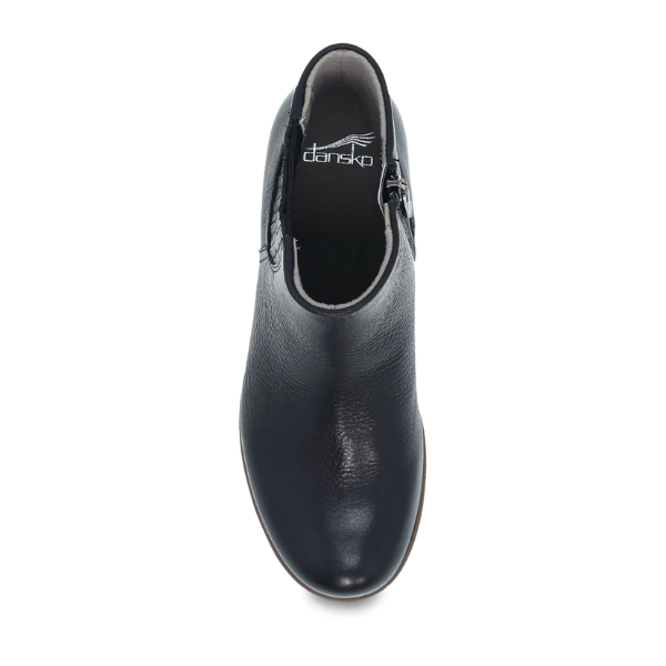 Top view of the Dansko Womens Daisie Waterproof Black shoe with a rounded toe, side zipper, visible DANSKO logo on the insole, and Natural Arch technology for comfort, shown against a plain white background.