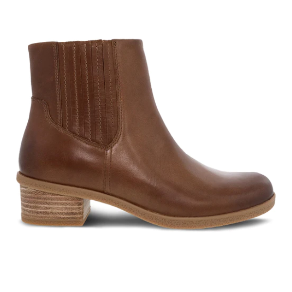 The DANSKO Womens Daisie Waterproof Tan boot features leather, a low stacked heel, elastic side panels, and Natural Arch support, shown in side profile on a white background.