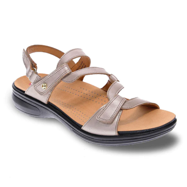 The Revere Womens Emerald Champagne sandal by REVERE features luxe metallic beige leather, adjustable Velcro straps, a cushioned tan footbed, perforated details, and a slightly elevated black rubber sole—perfect for easing foot pain in style.