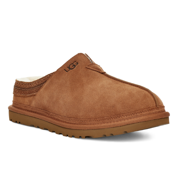 The UGG Mens Neuman Slipper Chestnut features brown suede, visible stitching, a thick Treadlite by UGG rubber sole, a soft UGGpure wool lining, and an embroidered UGG logo on the side.