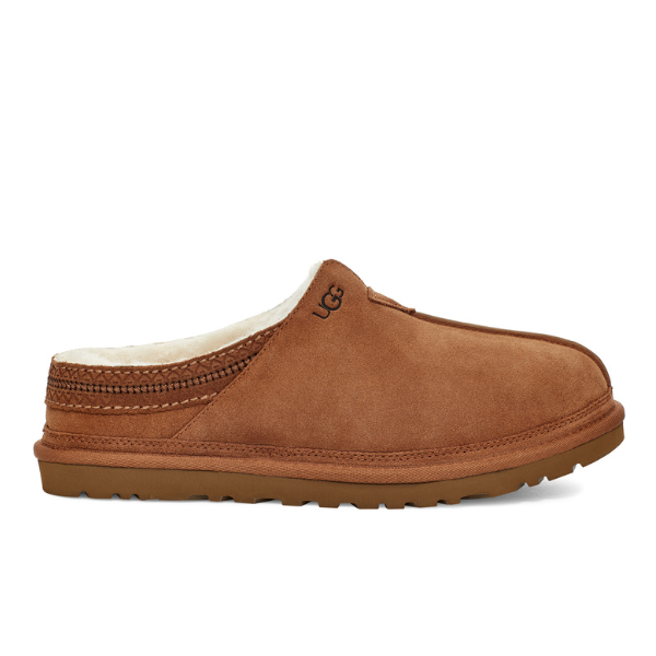 The UGG Mens Neuman Slipper in Chestnut features brown suede, white UGGpure wool lining, visible stitching, a textured Treadlite by UGG sole, and an embroidered side logo. It is shown in profile against a white background.