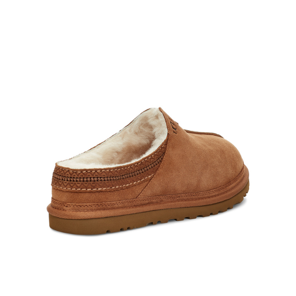 A chestnut UGG Mens Neuman Slipper with cozy UGGpure wool lining, visible stitching, and a textured Treadlite by UGG rubber sole, shown from the back side angle.