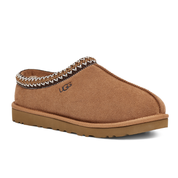 The UGG Mens Tasman Slipper Chestnut by UGG features a thick, durable outsole for foot pain comfort, white and brown stitching on the top edge, and the embroidered UGG logo on the side.