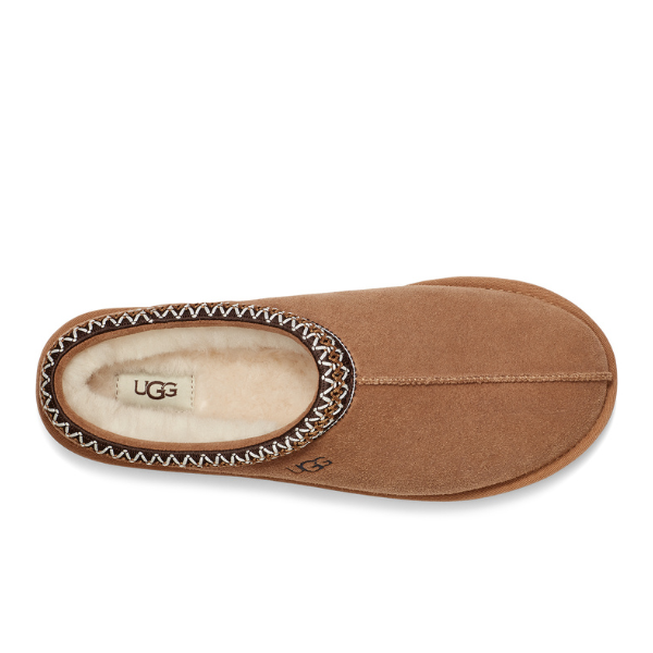 Top view of the UGG Mens Tasman Slipper Chestnut by UGG, featuring brown suede, cream fleece lining, decorative stitching at the opening, and a durable outsole designed for foot comfort.