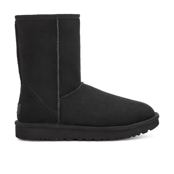 The UGG Womens Classic Short II Boot Black features black suede, a flat sole, and visible stitching, inspired by sheepskin boots. Photographed from the side against a white background for classic UGG comfort.