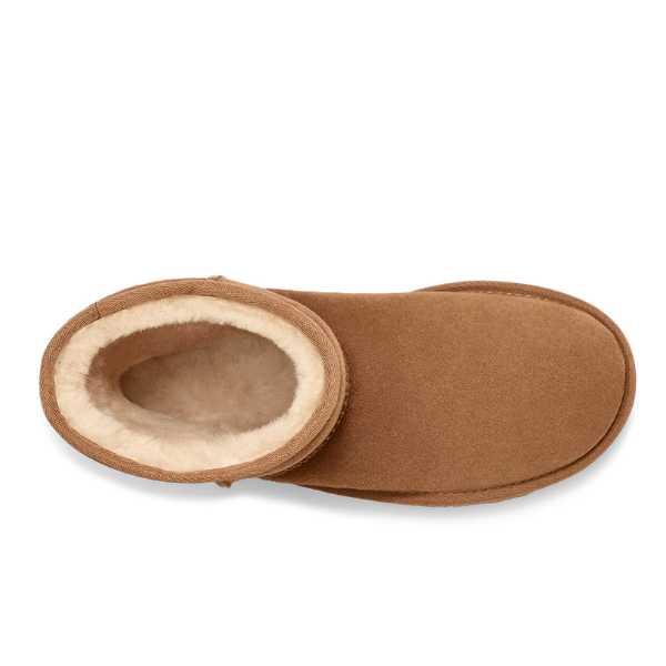 Top view of a single UGG Womens Classic Short II Boot in Chestnut, featuring tan suede and visible plush cream sheepskin lining.