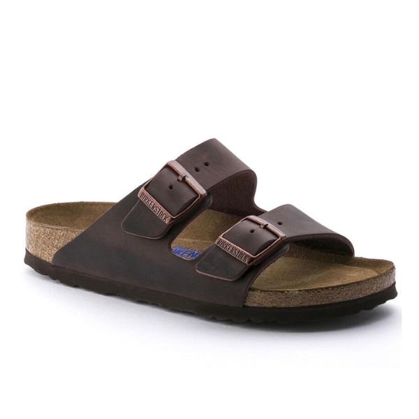 The BIRKENSTOCK Mens Arizona Soft Footbed Oiled Leather Habana sandal features two adjustable buckle straps and a soft footbed, shown in brown oiled leather from a side angle against a white background.