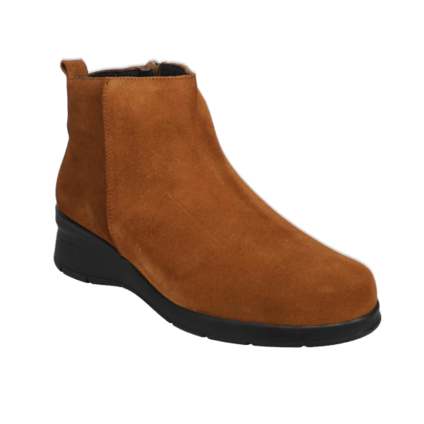 The Sovella Womens Aryss Boot Tobacco is a brown suede ankle boot with a black rubber sole, side zipper, and low wedge heel—ideal for plantar fasciitis relief. Brand: SOVELLA. Displayed on a white background.