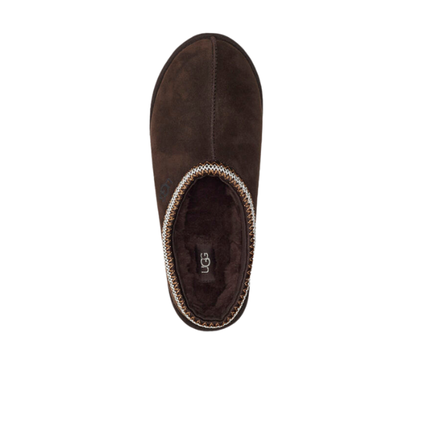Top view of a single UGG Mens Tasman Slippers Brown by UGG, showcasing a dark brown suede upper, plush sheepskin lining, and decorative stitching along the opening on a white background.