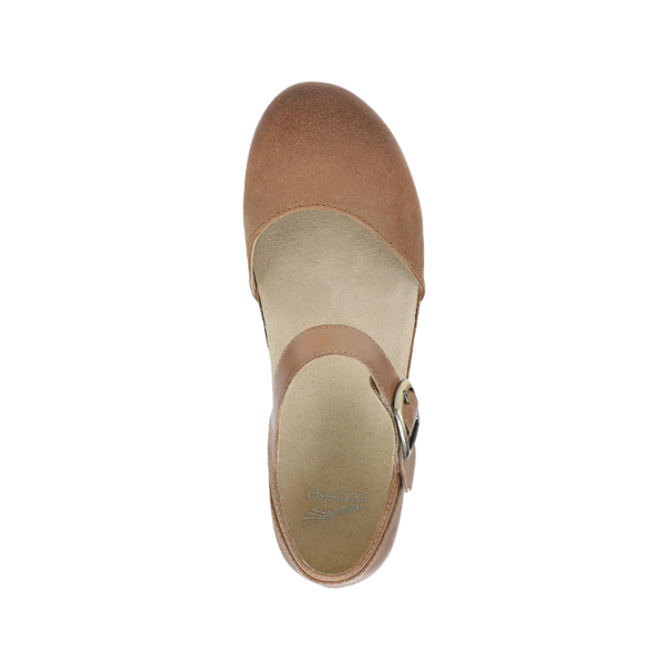 Top view of the Dansko Womens Mae Tan Suede Mary Jane by DANSKO, featuring a rounded toe, side buckle strap, and lightweight EVA and cork soles, set against a white background.