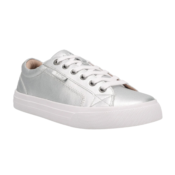 The TAOS Taos Womens Plim Soul Lux Silver is a silver leather low-top sneaker with white laces and rubber sole, seen from a front-side angle on a plain background. It offers added metatarsal support for everyday comfort and style.