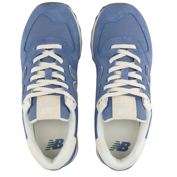 A top-down view of the New Balance Women's 574 Blue sneakers, featuring white laces and inner lining by NEW BALANCE, placed side by side on a white background.