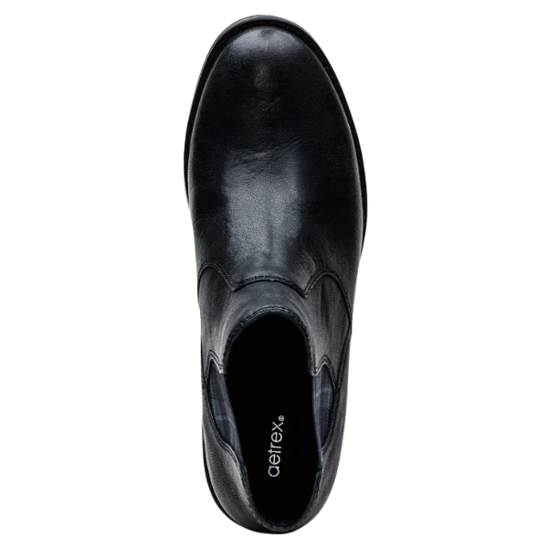 Black leather boot with 'Aetrex' branding on a white background