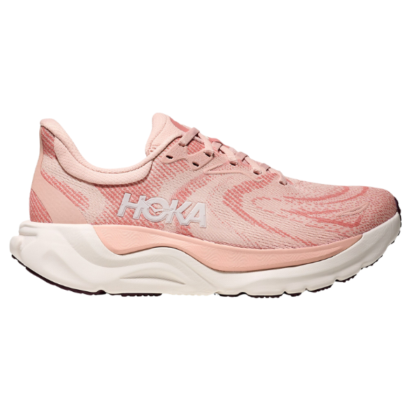 The HOKA Women's Arahi 8 Blush/Rose is a stability running shoe with a textured pink upper, light cream sole, white HOKA logo, and support for overpronation.