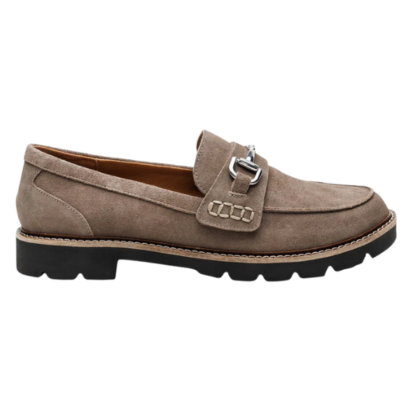 The AETREX Women's Collette Suede Taupe loafer features arch support, a taupe suede upper, silver buckle, visible stitching, and a chunky black rubber sole, shown in side profile.