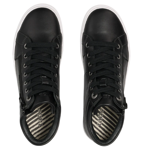 The TAOS Women's Winner Black sneakers feature leather uppers, lace-up design, side zippers, white outsole trim, and striped insoles with the taös logo—viewed from above in sleek black.