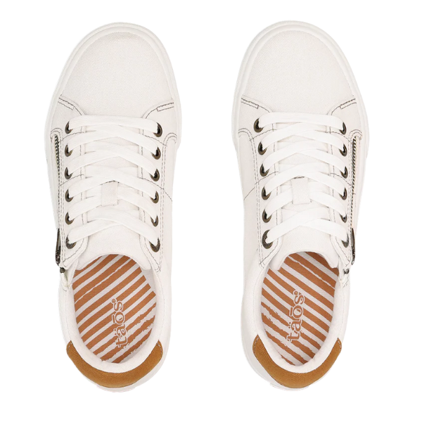 The TAOS Women's Z Soul White/Tan sneakers feature brown heel accents, striped tan and white insoles, side zippers, and lace-up fronts—comfortable footwear designed for all-day wear, shown from above.