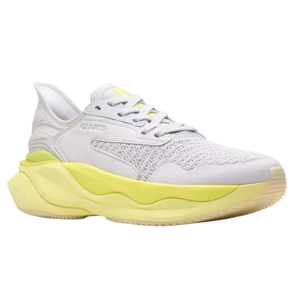 The Clarks Women's Pace Lime by CLARKS is a stylish athleisure walking shoe with a white and light gray knit upper, yellow accents on the side and heel, plus a yellow and off-white sole, displayed on a plain white background.