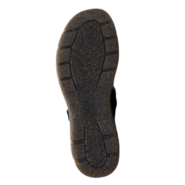 A close-up of the tread pattern on the sole of the CLARKS Orlene Jane Black Leather Mary Jane, highlighting textured grooves for traction against a white background—ideal for women's casual comfort.