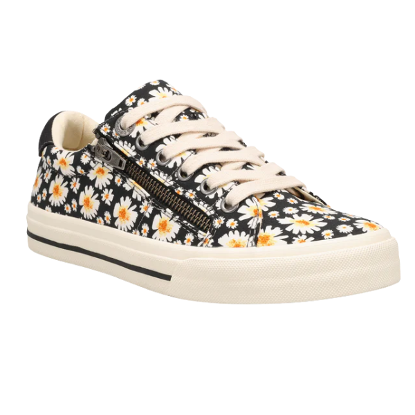 The Taos Women's Z Soul Daisy Black by TAOS is a stylish low-top canvas sneaker featuring a black daisy floral print, cream laces, side zipper, white sole with black stripe, and added arch support for comfort.