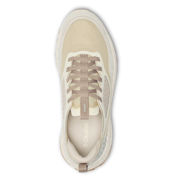 Top view of the OLUKAI Women's Makiki Lava White Sand trail running shoe, featuring taupe laces, mesh toe, subtle branding, white sole, and pull tab—crafted for all-terrain performance and everyday comfort.