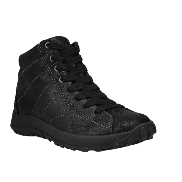 The Taos Women's Trail Mix Black by TAOS is a black high-top sneaker with textured finish, black laces, rugged sole, and visible stitching. It combines boot-like comfort and style with a supportive footbed. Shown on a plain white background.