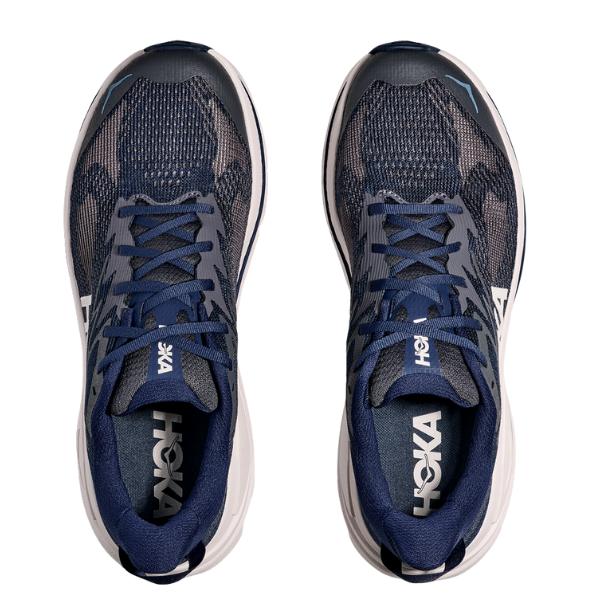 A pair of HOKA Men's Challenger 8 Blue/Grout Wide trail running shoes with navy mesh uppers, dark blue laces, white accents, and visible white HOKA logos on the insoles and midsoles are shown from above.
