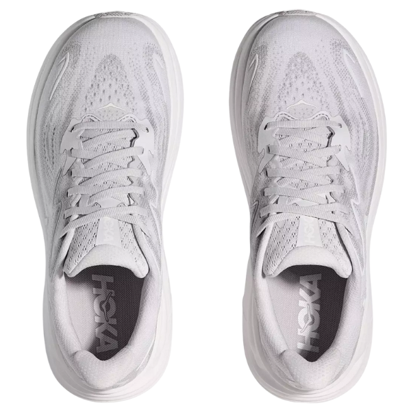 Top view of HOKA Women's Clifton 10 Cosmic Grey running shoes with laces and mesh upper, showing the HOKA logo on the insoles—perfectly cushioned for comfort, especially suitable for plantar fasciitis.