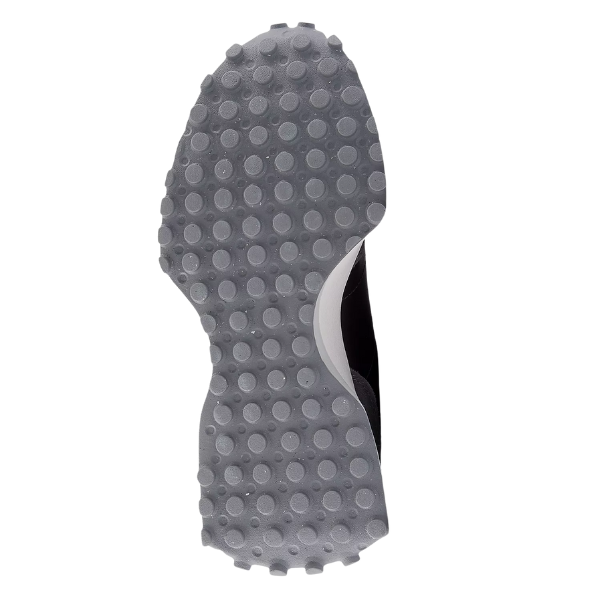The New Balance Women's 327 Black/Castlerock features a grey sole with circular grips for foot pain relief during runs.