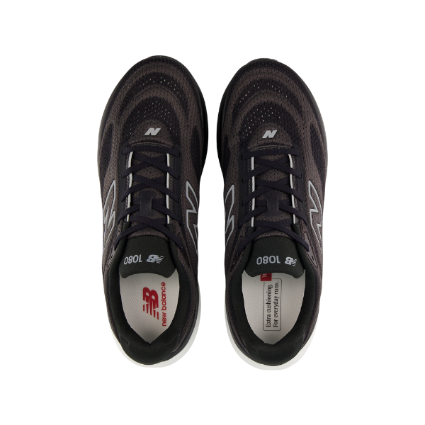 Top view of New Balance Men's 1080v15 Wide Black/White shoes with white soles and branded tongues and insoles.
