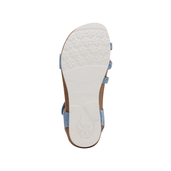 Bottom view of Aetrex Women's Jillian Denim sandals with a white floral sole and light blue straps—by AETREX.
