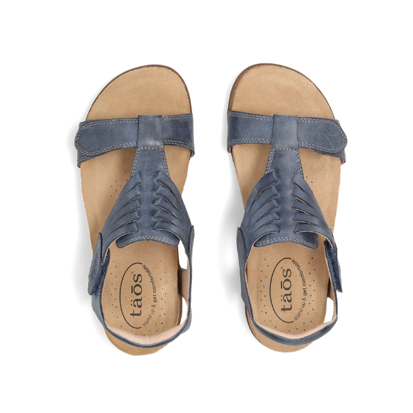 TAOS Women's Wonderful Dark Blue sandals with woven Italian leather straps and cushioned tan insoles.