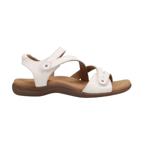 TAOS Big Time Women's white sandal with adjustable straps and SOFT SUPPORT footbed, side view.