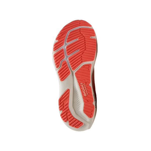 The image shows the cushioned sole of the BROOKS Women's Glycerin GTS 23 Coral/Peach running shoe from below.