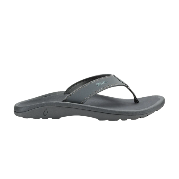 The OLUKAI Men's Ohana Grey sandal features a cushioned sole and simple thong strap, shown in a side view.