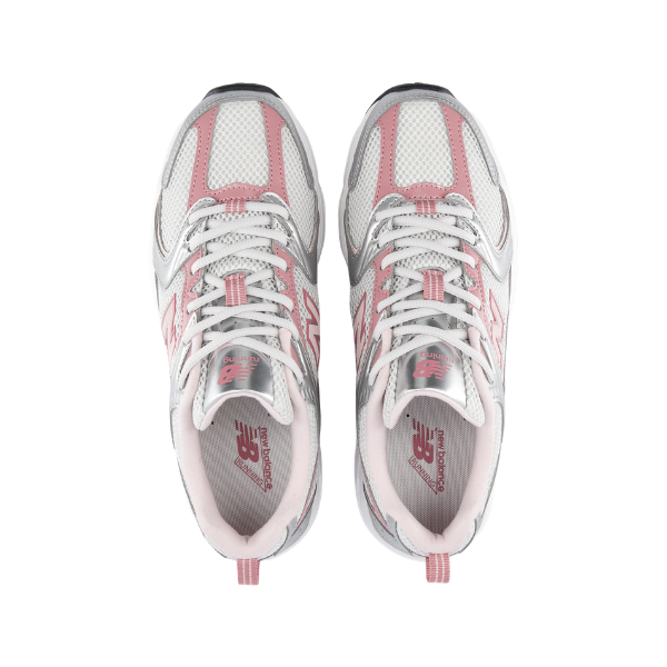 Top view of New Balance Women's 530 Silver/Rose Wide running shoes with mesh and synthetic details on a white background.