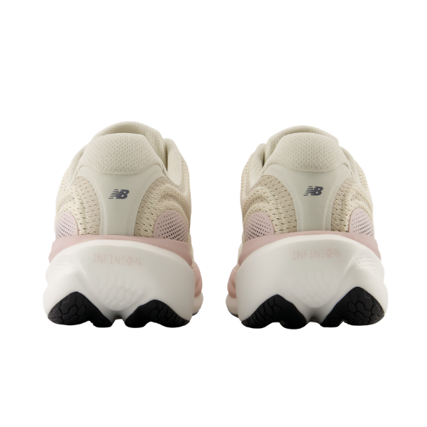 Rear view of NEW BALANCE Women's 1080V15 Beige/White running shoes with cushioned white soles, side by side.