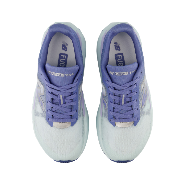 A pair of NEW BALANCE Wfcx5tv | W Rebel V5 Blue running shoes viewed from above on a white background.