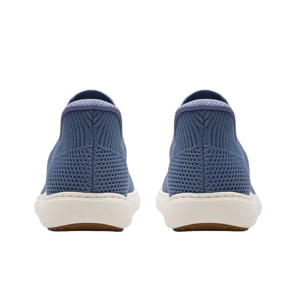 Back view of CLARKS Clark's Women's Nalle Step Grey/Blue slip-on sneakers with knit upper and white soles.