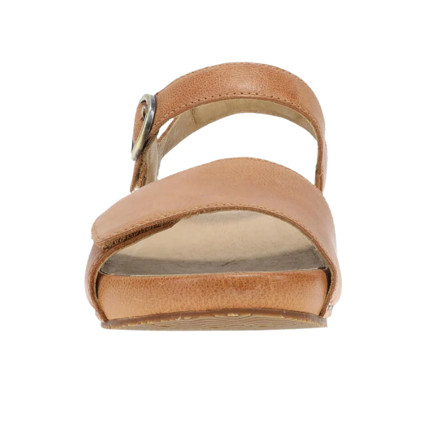 Front view of the Dansko Women's Tinsley Natural platform sandal with adjustable ankle strap and buckle on white background.