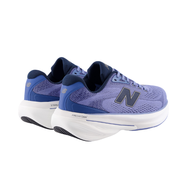 New Balance Men's 860v15 in blue/white with navy interiors and black "N" logos; white soles.
